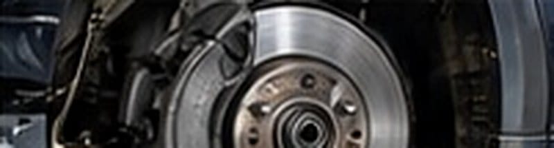 Brake disc and caliper exposed during a brake repair in Oakleigh South